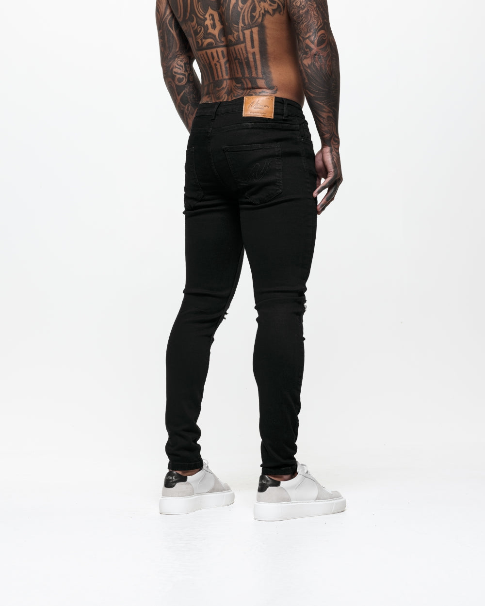 Ripped &amp; Repaired Skinny Jeans - Black